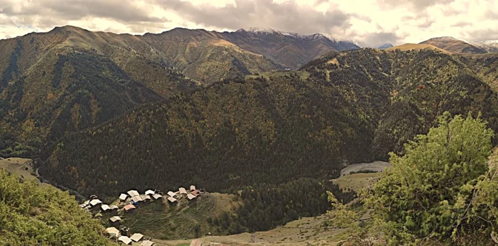 Scenic panoramic view of Dochu village in Tusheti region during a high Caucasus mountain expedition in Georgia.