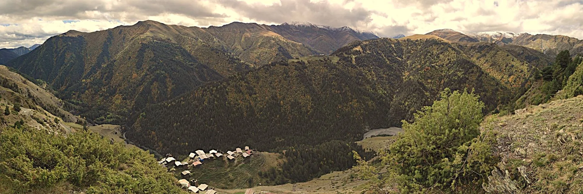 Scenic panoramic view of Dochu village in Tusheti region during a high Caucasus mountain expedition in Georgia.