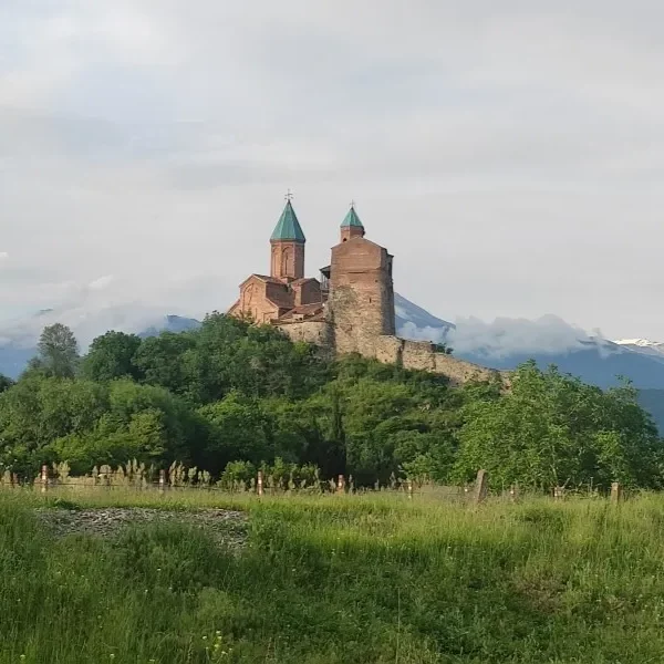 Gremi Monastery in Kakheti against the Caucasus Mountains.