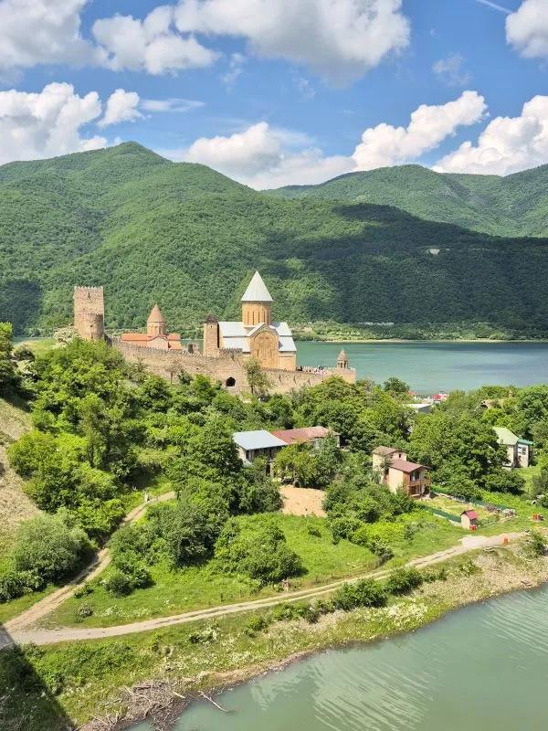 Ananuri Fortress complex overlooking the turquoise water on the way to Jvari Pass