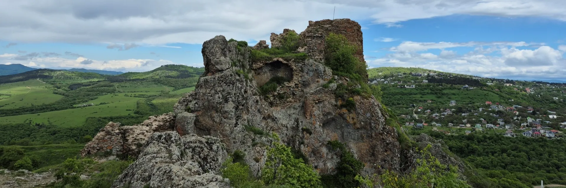 Panoramic green valley and Kojori village view from Khoroghli Castle ruins