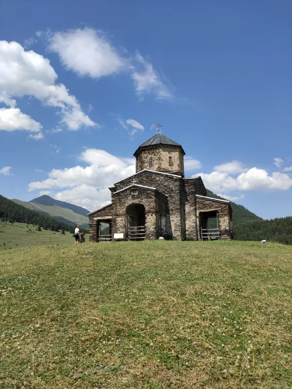 The historic Holy Trinity stone church standing on a hill in Shenako