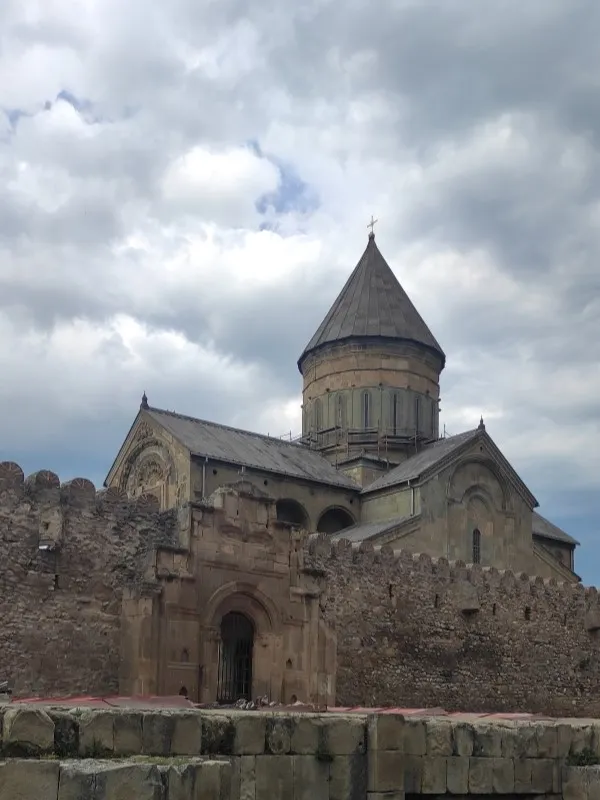 The medieval fortress walls and conical dome of Svetitskhoveli Cathedral