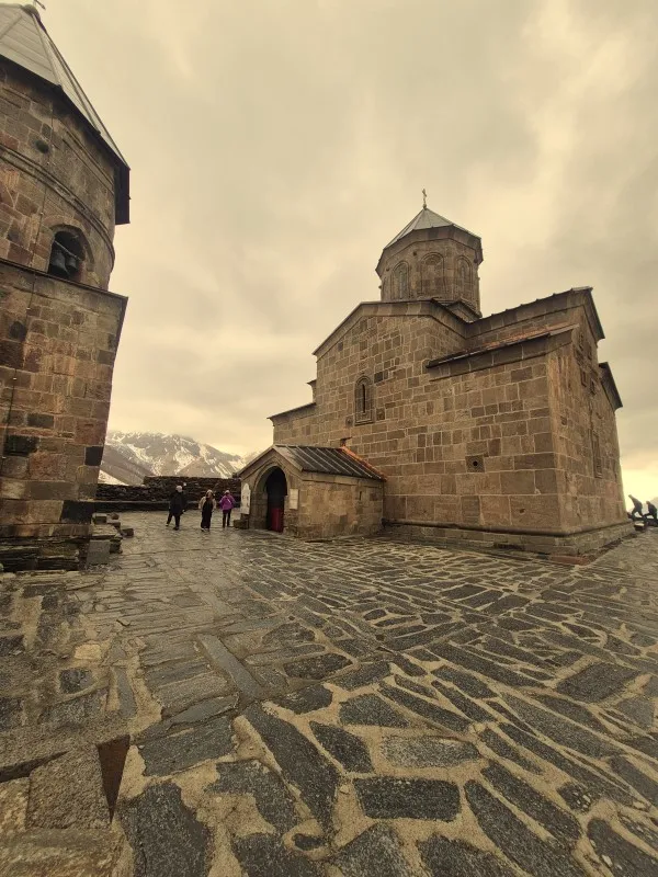 Medieval Stone Architecture and Courtyard of Gergeti Trinity Church