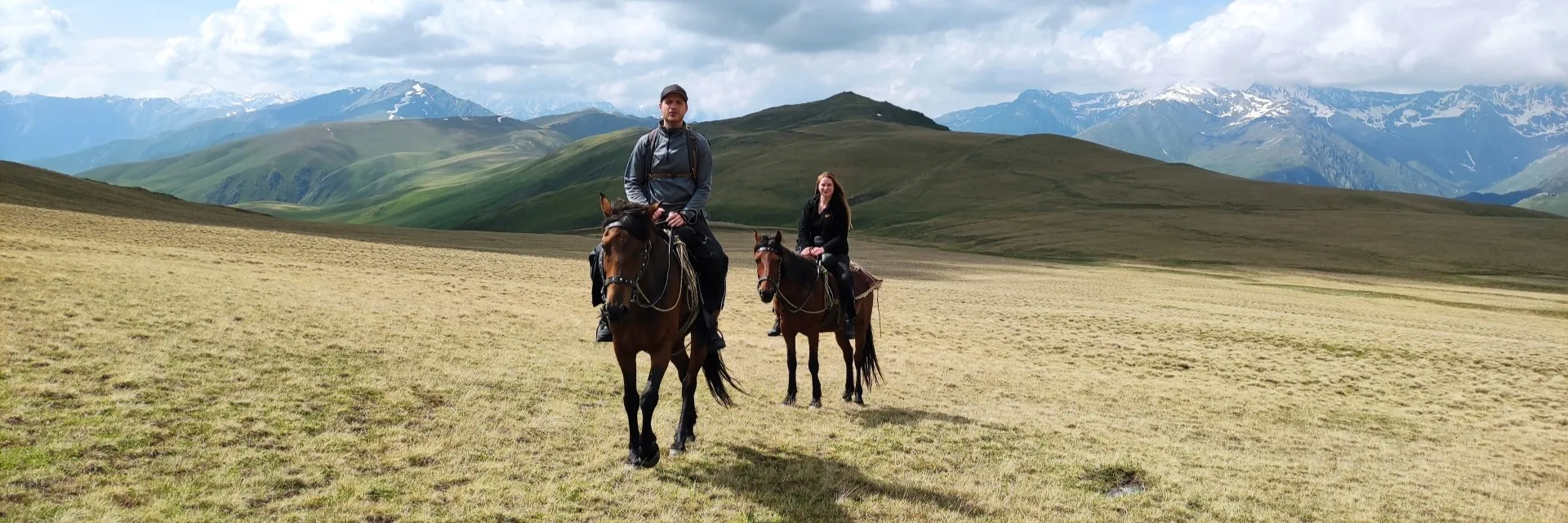 Horseback riding in Tusheti across scenic alpine mountain ridges and plateaus
